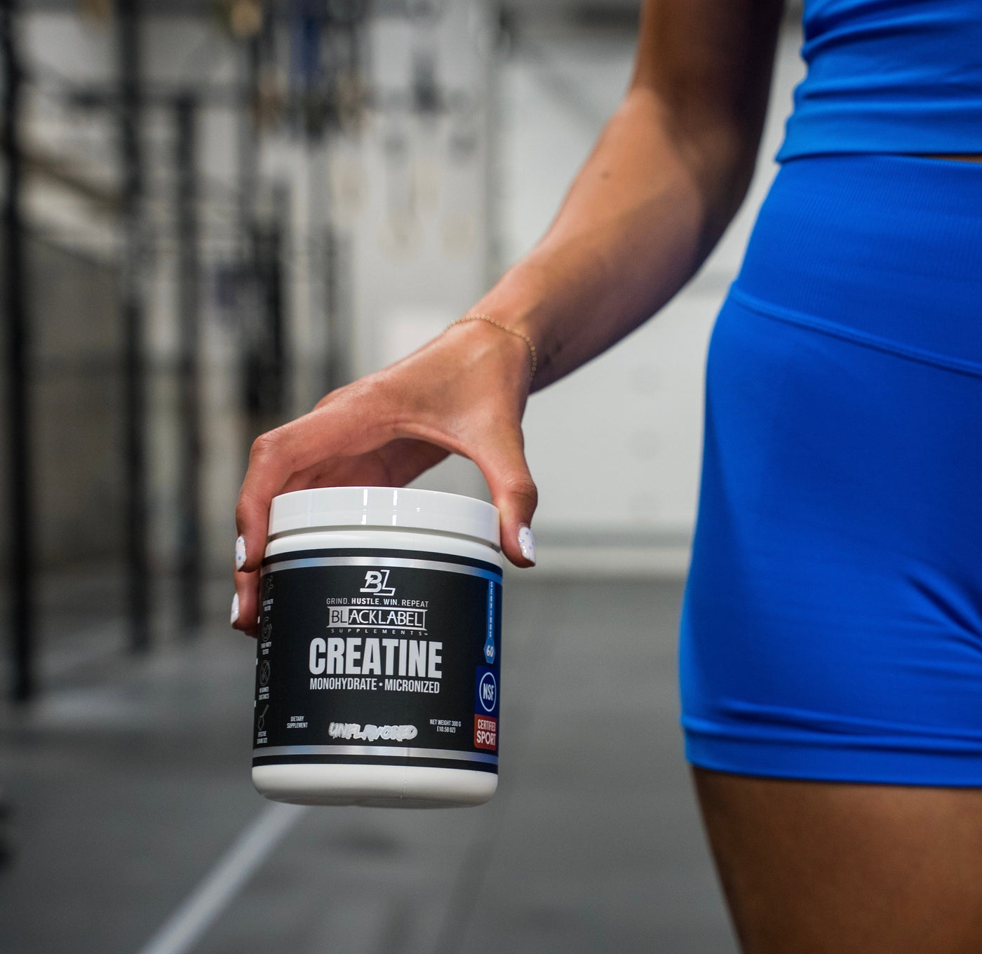 Creatine Monohydrate held by athlete